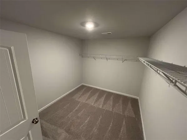 a bathroom with a sink a toilet a mirror and vanity