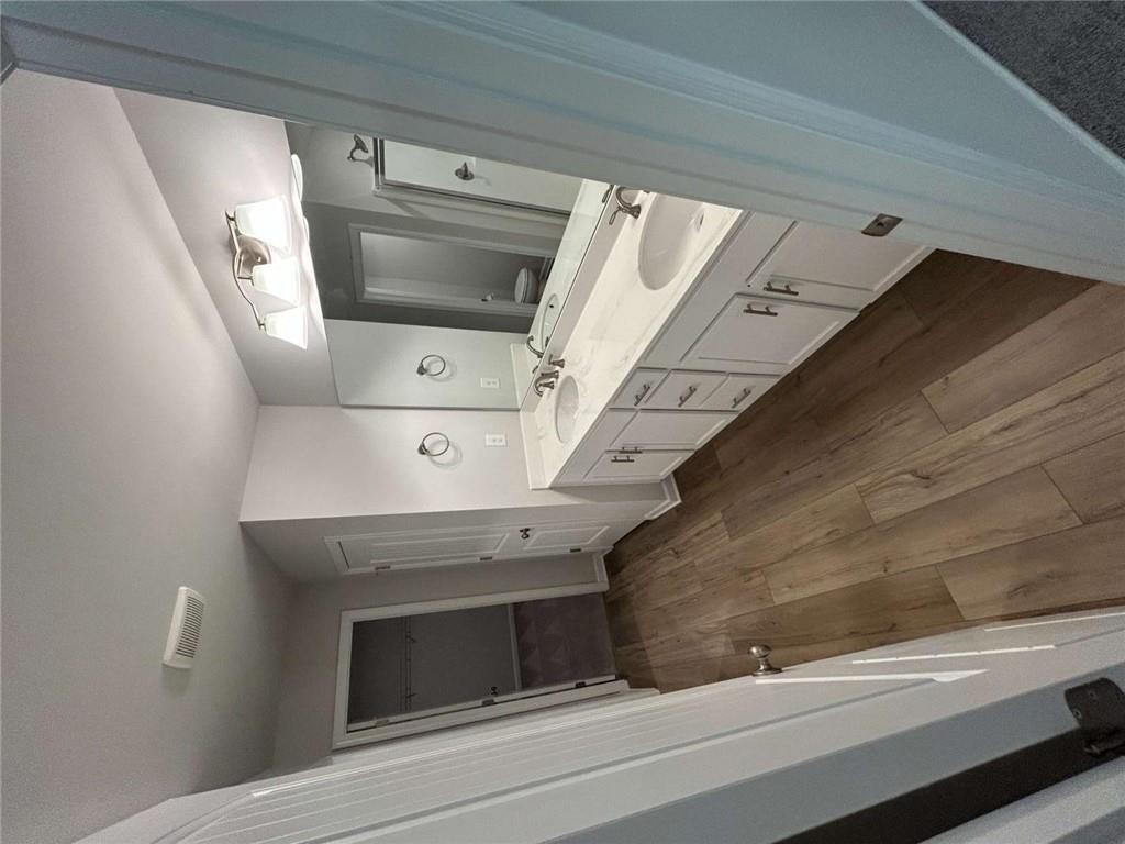 4 Stonebrook Drive Rome, GA 30165 - Photo 14 of 19 a bathroom with a sink a toilet a mirror and vanity