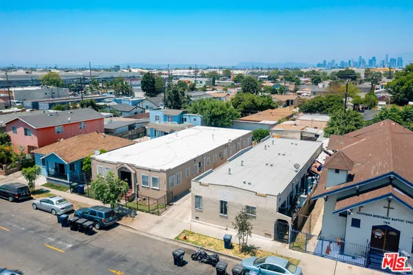 an aerial view of houses with outdoor space