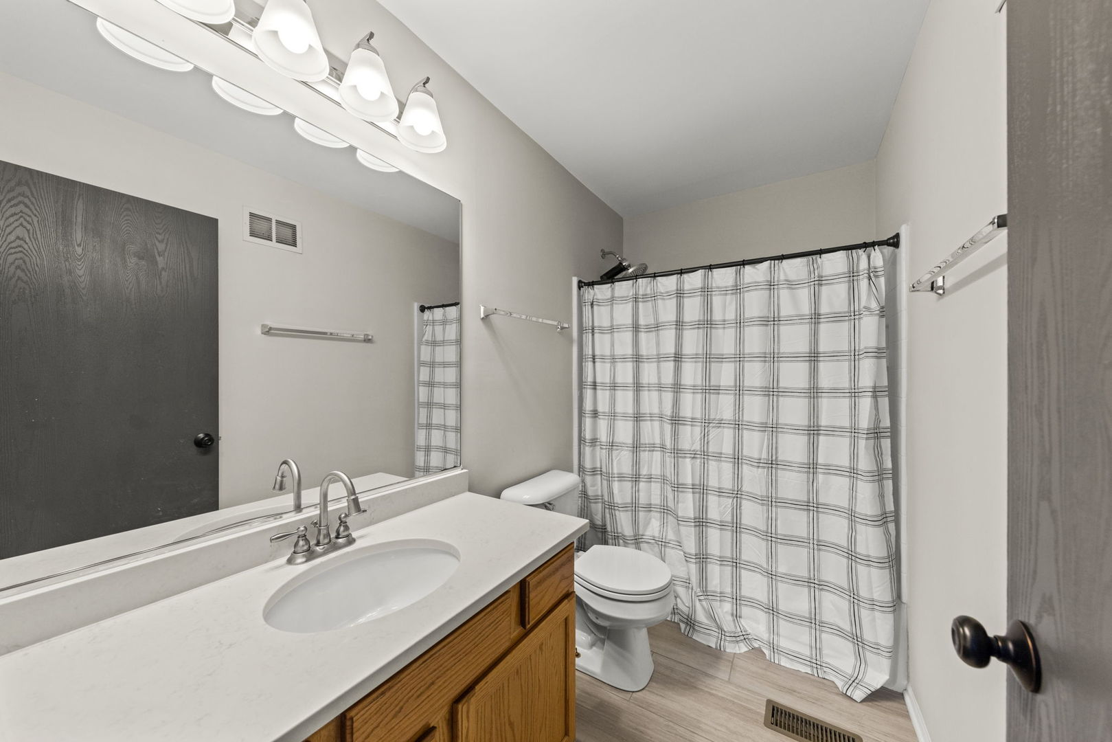 31 Harmony Lane Romeoville, IL 60446 - Photo 19 of 27 a bathroom with a sink a toilet and shower