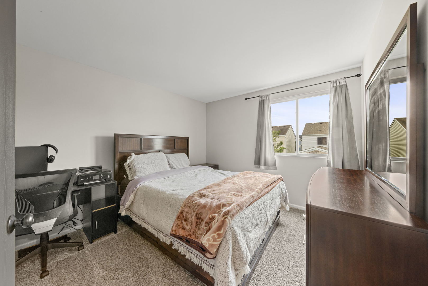 31 Harmony Lane Romeoville, IL 60446 - Photo 21 of 27 a bedroom with a bed and a table in it