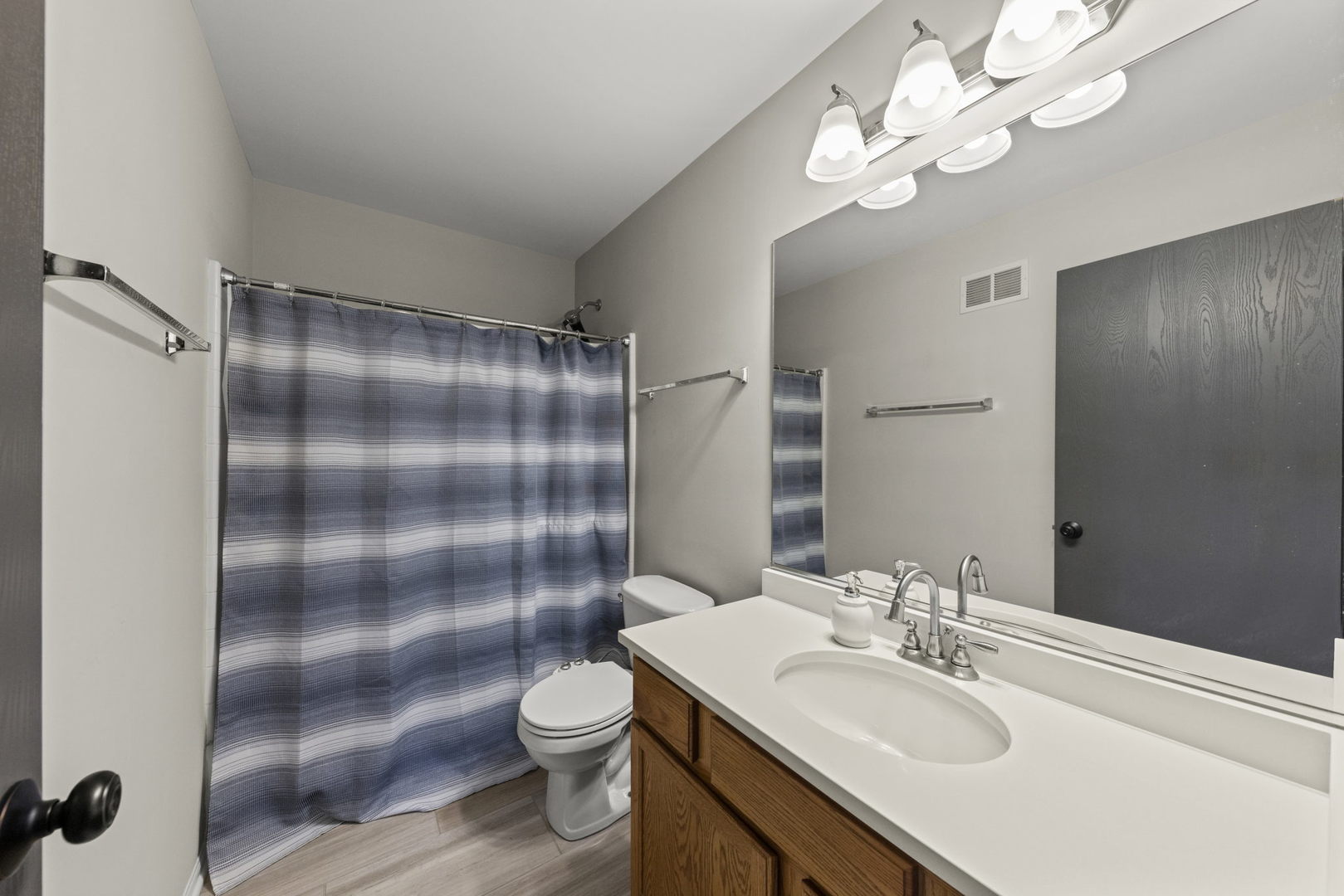 31 Harmony Lane Romeoville, IL 60446 - Photo 22 of 27 a bathroom with a sink a toilet and shower