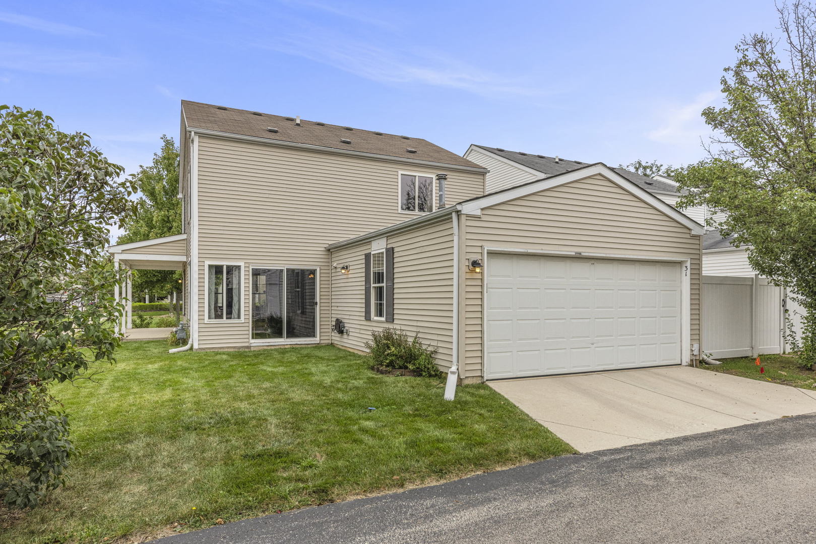 31 Harmony Lane Romeoville, IL 60446 - Photo 4 of 27 a front view of a house with a yard and garage