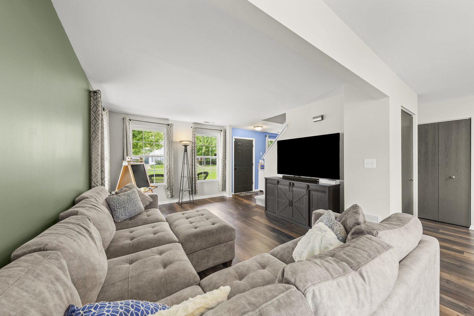 31 Harmony Lane Romeoville, IL 60446 - Photo 8 of 27 a living room with furniture and a flat screen tv