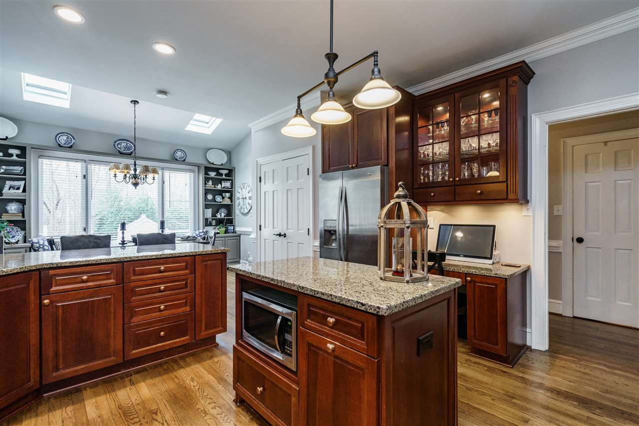 10709 Dunhill Terrace Raleigh, NC 27615 - Photo 12 of 30 Granite countertops, stainless steel appliances and warm hardwood floors are just some of the features. Kitchen