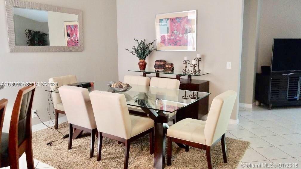 1653 Zenith Way Weston, FL 33327 - Photo 13 of 22 a view of a dining room with furniture