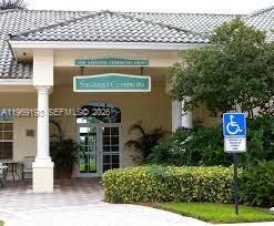 1653 Zenith Way Weston, FL 33327 - Photo 17 of 22 a sign that is on the side of a building