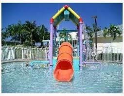1653 Zenith Way Weston, FL 33327 - Photo 18 of 22 a backyard of a house with table and chairs
