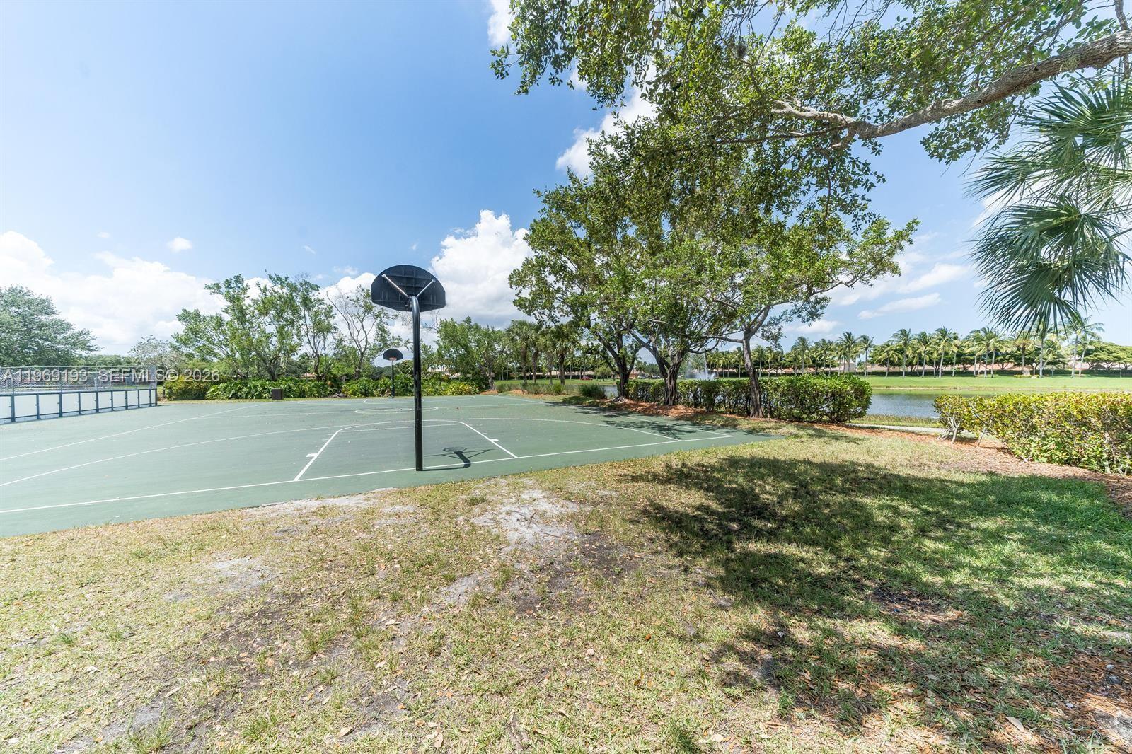 1653 Zenith Way Weston, FL 33327 - Photo 22 of 22 a view of a park with large trees