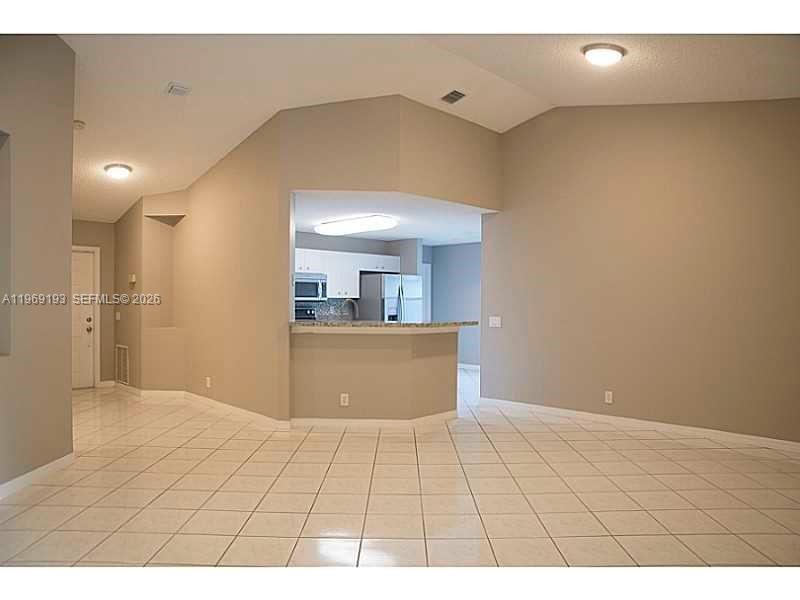 1653 Zenith Way Weston, FL 33327 - Photo 7 of 22 a view of an empty room