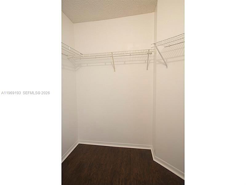 1653 Zenith Way Weston, FL 33327 - Photo 9 of 22 a view of a room with wooden floor