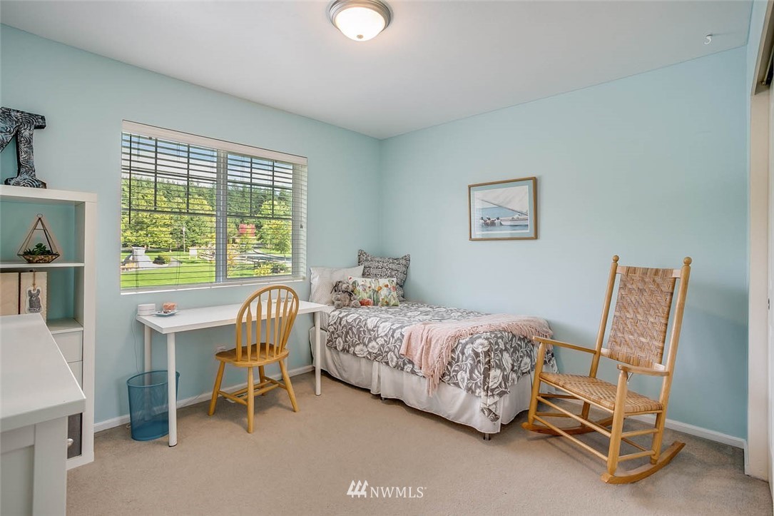 27555 Maple Ridge Way Southeast Maple Valley, WA 98038 - Photo 16 of 25 a bedroom with a bed chair and a window