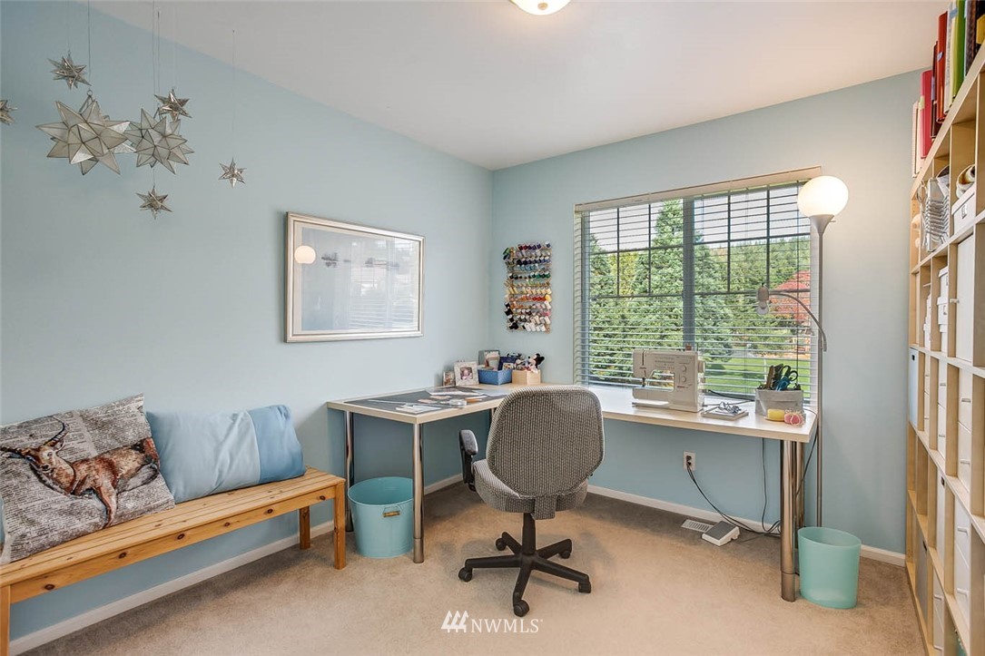 27555 Maple Ridge Way Southeast Maple Valley, WA 98038 - Photo 18 of 25 a view of a workspace with lounge chair and a window