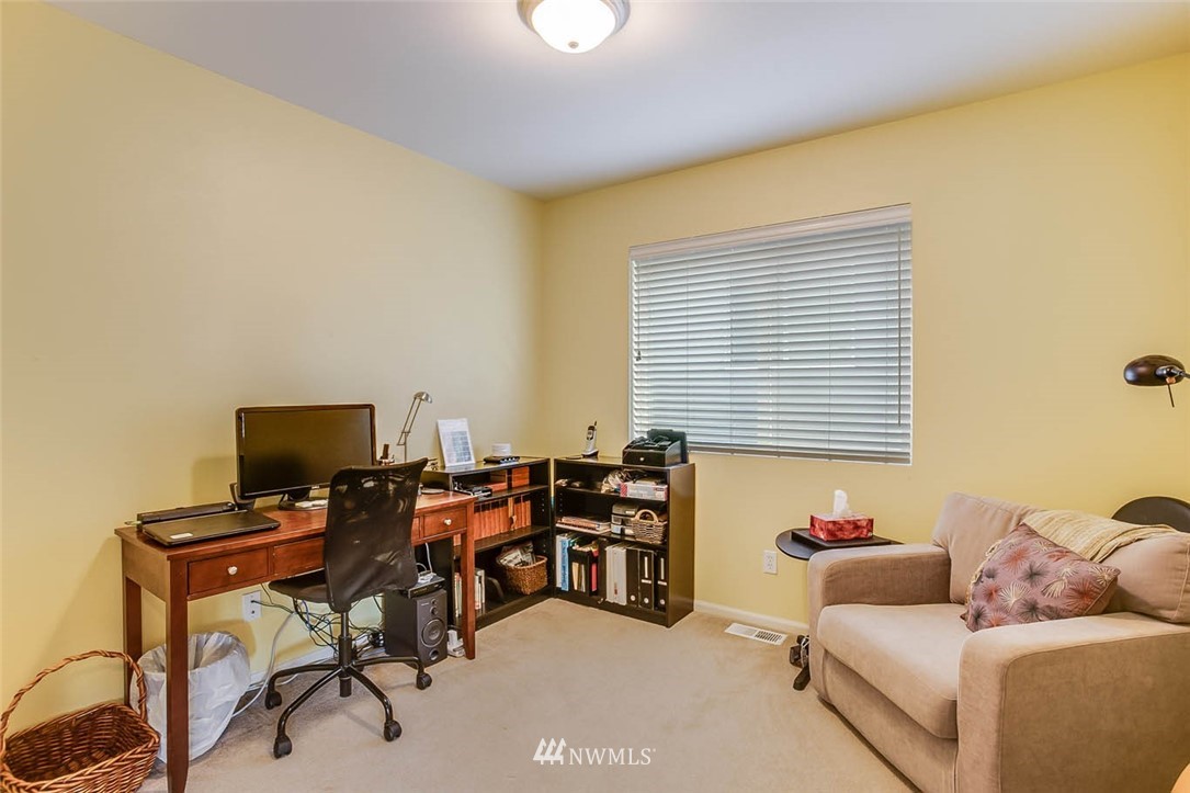 27555 Maple Ridge Way Southeast Maple Valley, WA 98038 - Photo 19 of 25 a livingroom with workspace and a window