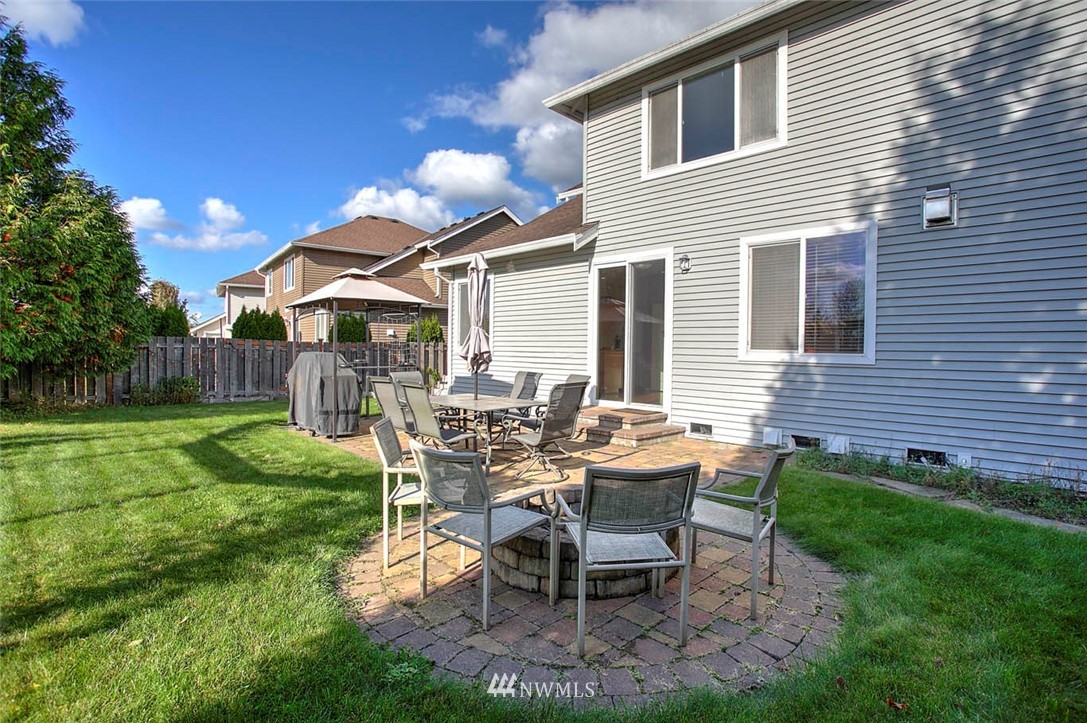 27555 Maple Ridge Way Southeast Maple Valley, WA 98038 - Photo 23 of 25 a view of a house with backyard and sitting area