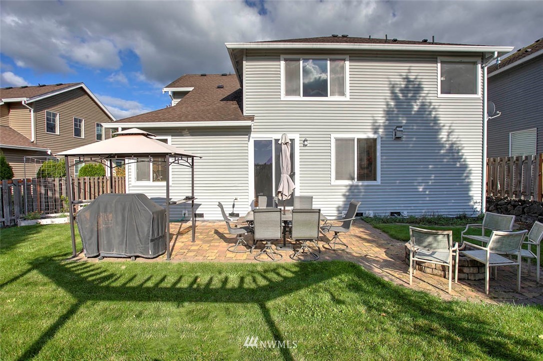 27555 Maple Ridge Way Southeast Maple Valley, WA 98038 - Photo 24 of 25 a view of a house with backyard and sitting area