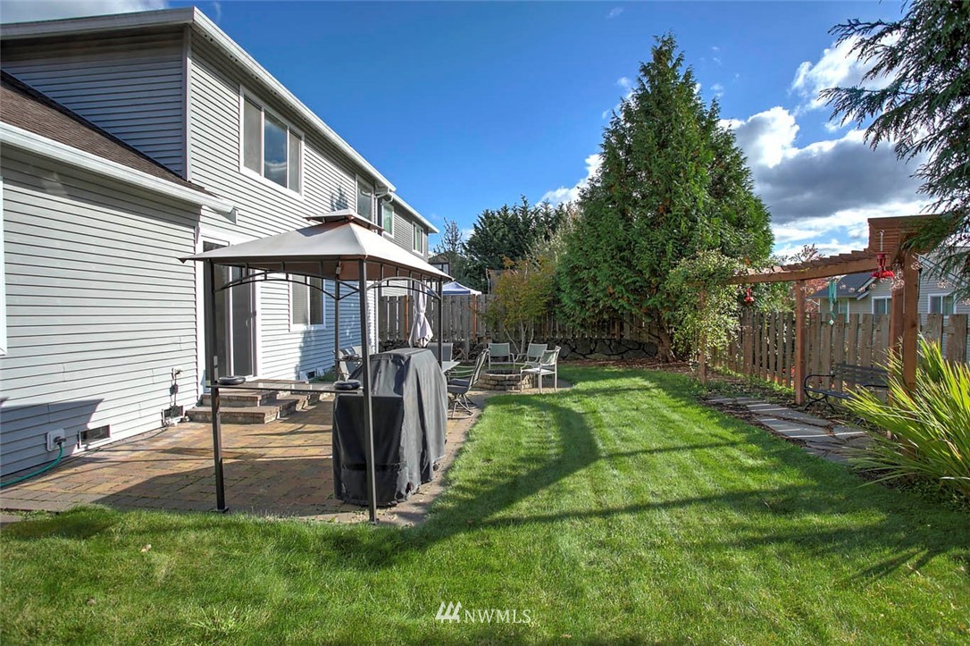 27555 Maple Ridge Way Southeast Maple Valley, WA 98038 - Photo 25 of 25 a view of a house with backyard