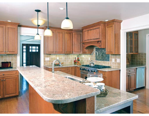 76 Drumlin Road Newton, MA 02459 - Photo 4 of 4 a kitchen with kitchen island granite countertop wooden cabinets and a stove