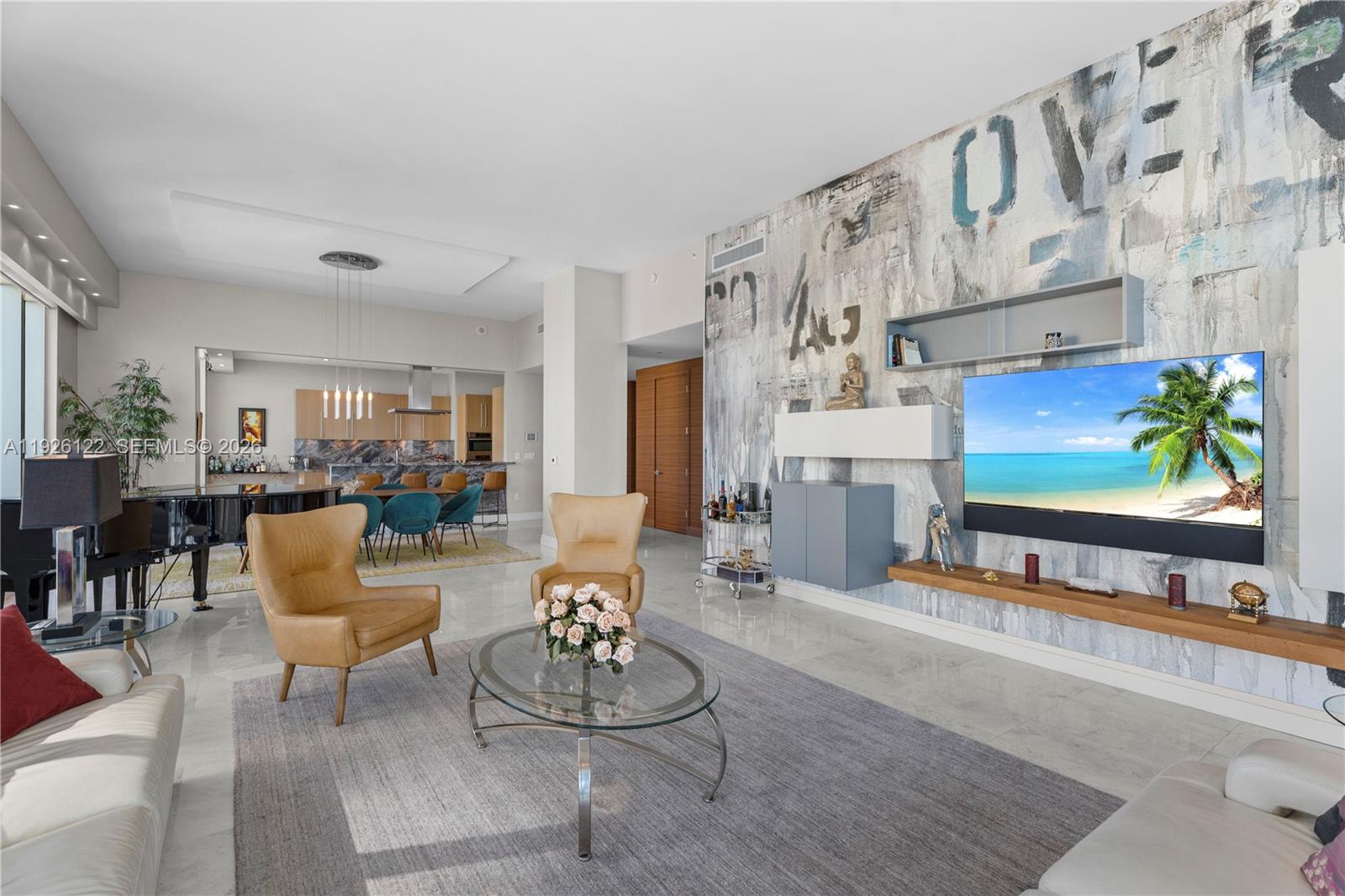 900 Brickell Key Boulevard, Unit 803 Miami, FL 33131 - Photo 12 of 38 a living room with fireplace furniture and a painting on the wall