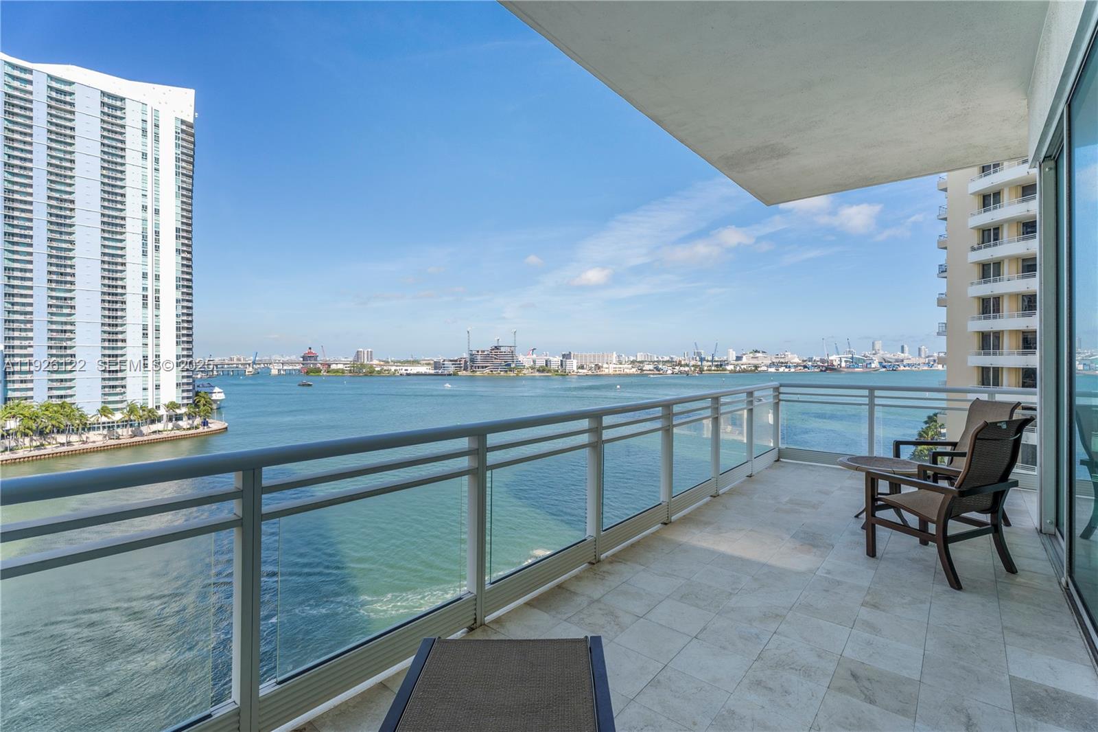 900 Brickell Key Boulevard, Unit 803 Miami, FL 33131 - Photo 16 of 38 a view of a terrace with chairs
