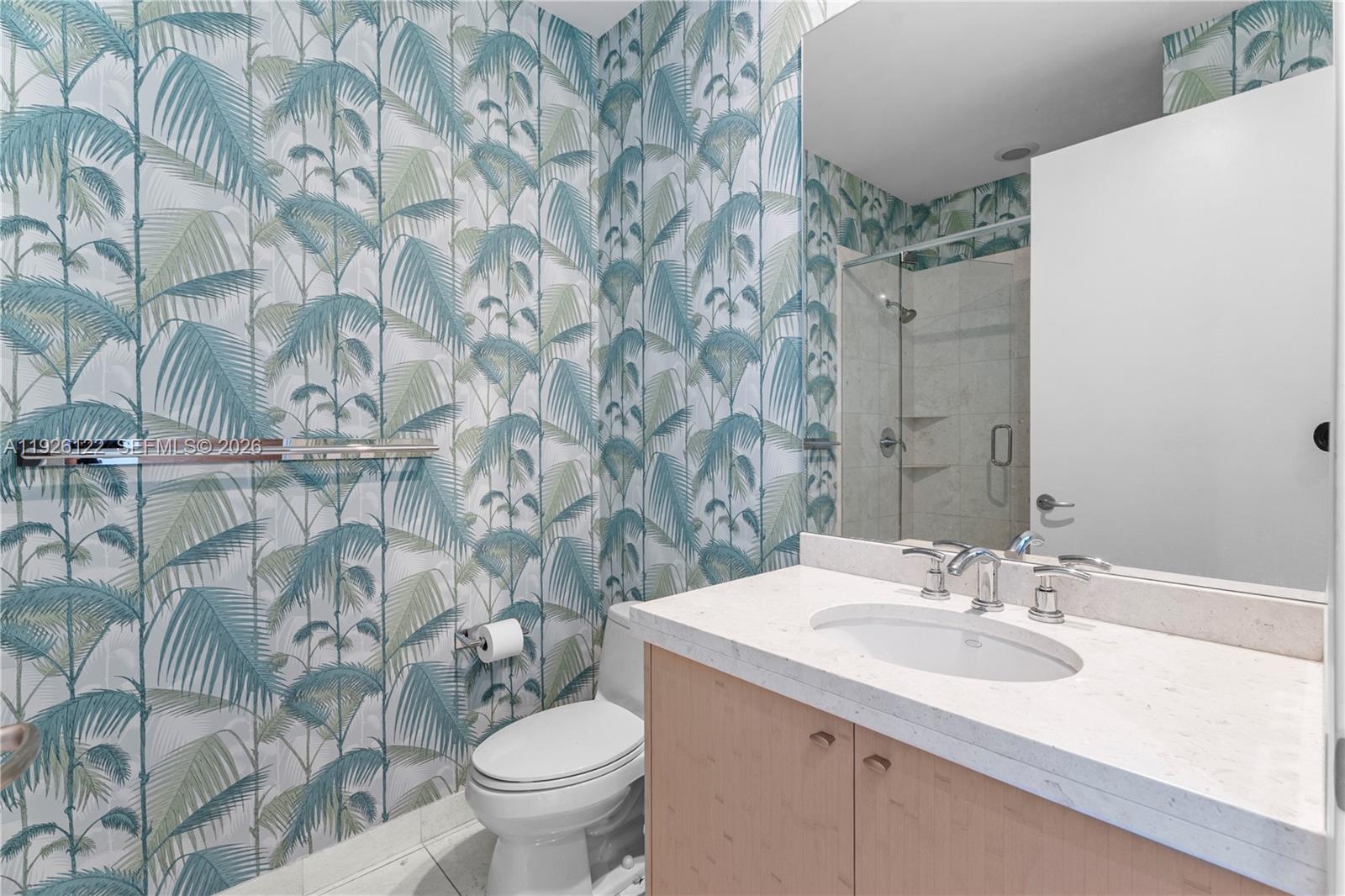 900 Brickell Key Boulevard, Unit 803 Miami, FL 33131 - Photo 23 of 38 a bathroom with a sink and a toilet