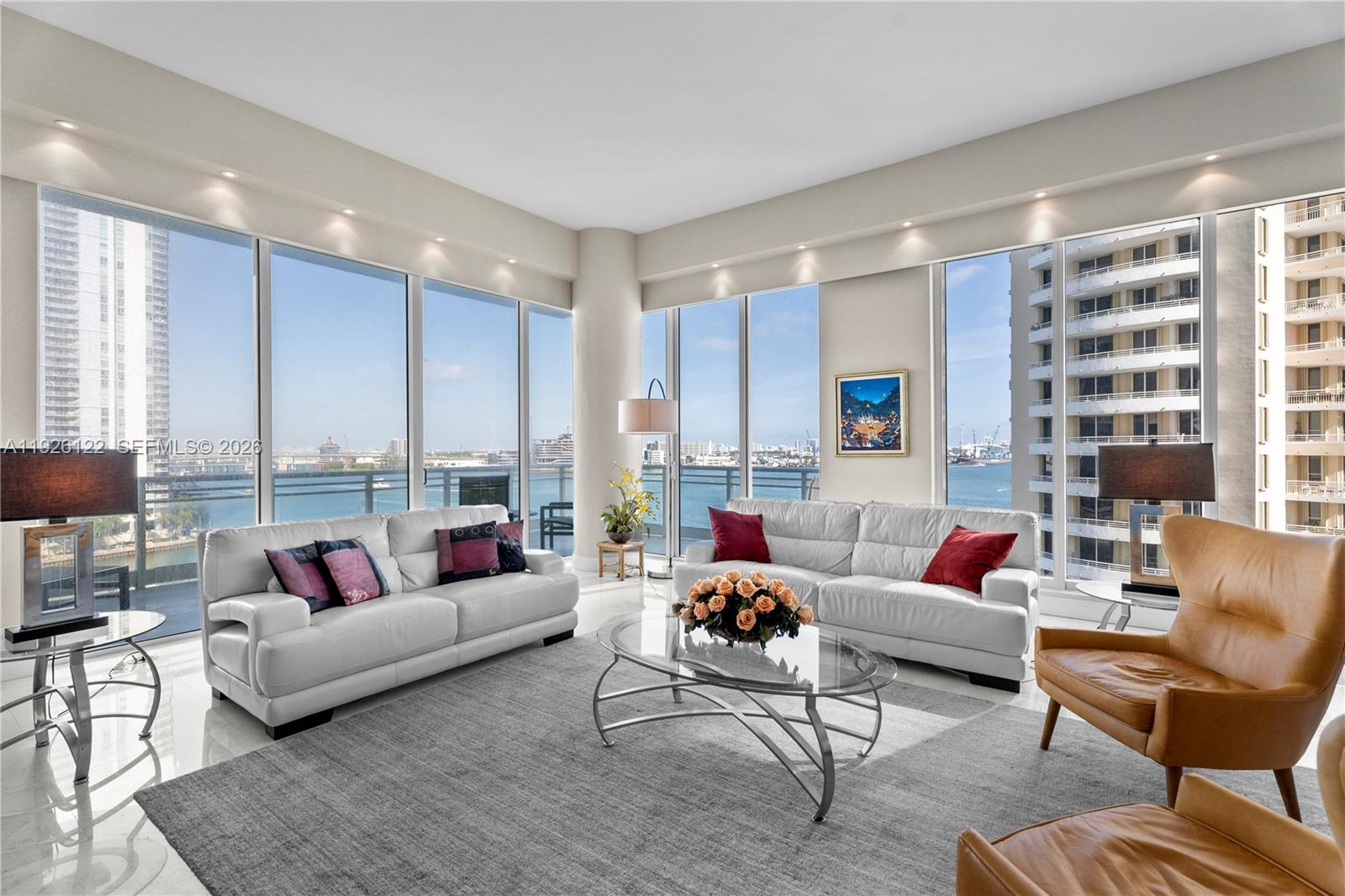 900 Brickell Key Boulevard, Unit 803 Miami, FL 33131 - Photo 3 of 38 a living room with furniture and a large window