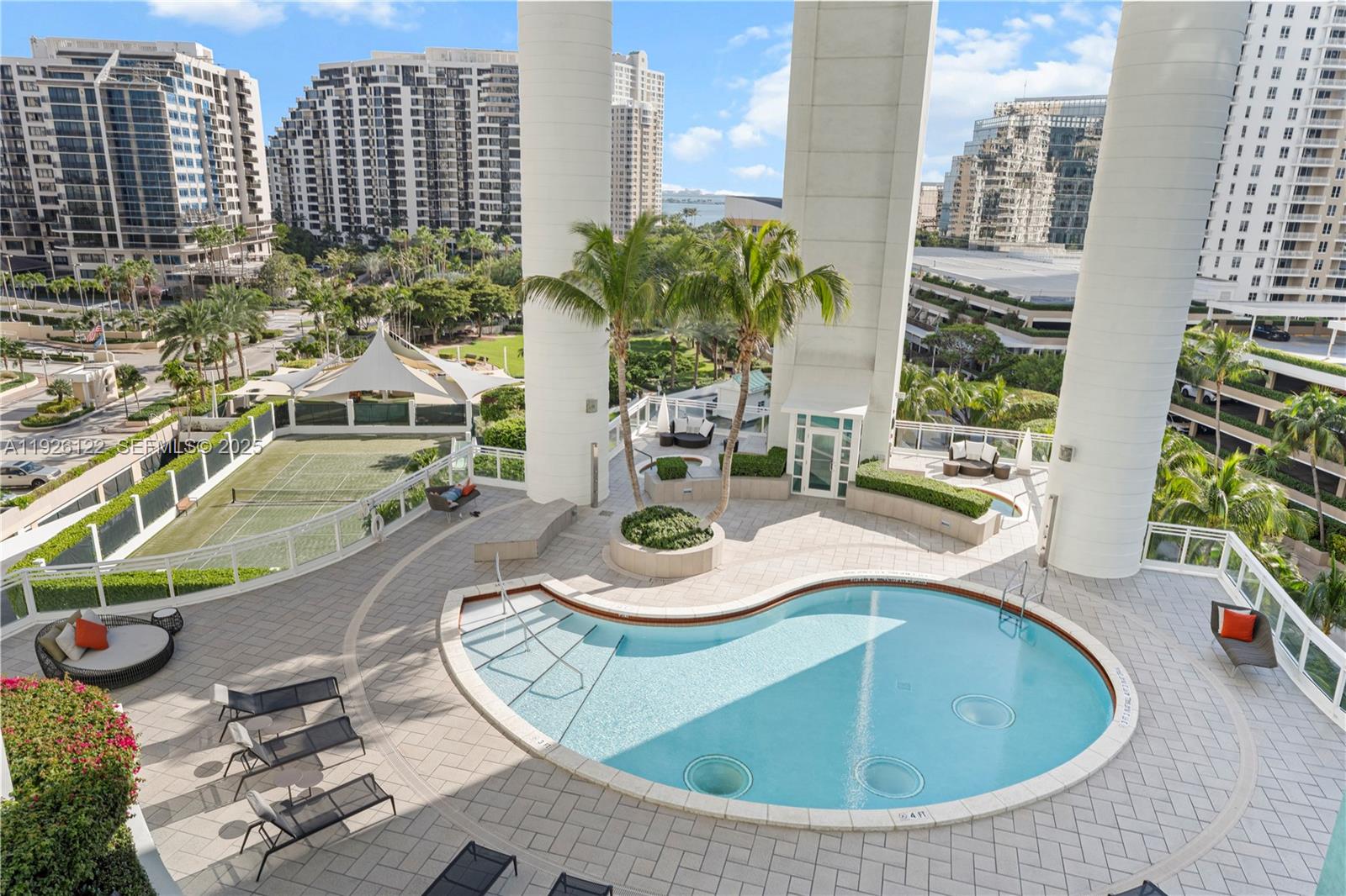 900 Brickell Key Boulevard, Unit 803 Miami, FL 33131 - Photo 34 of 38 a view of a swimming pool with chairs