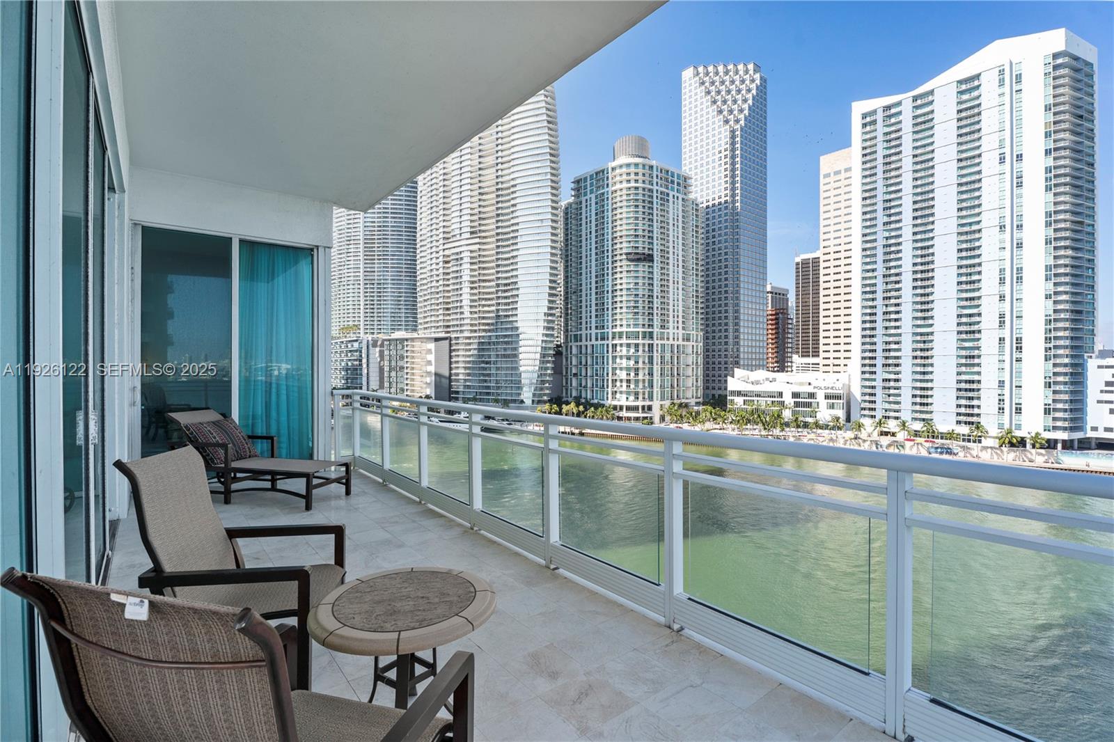 900 Brickell Key Boulevard, Unit 803 Miami, FL 33131 - Photo 35 of 38 a room with furniture and a window