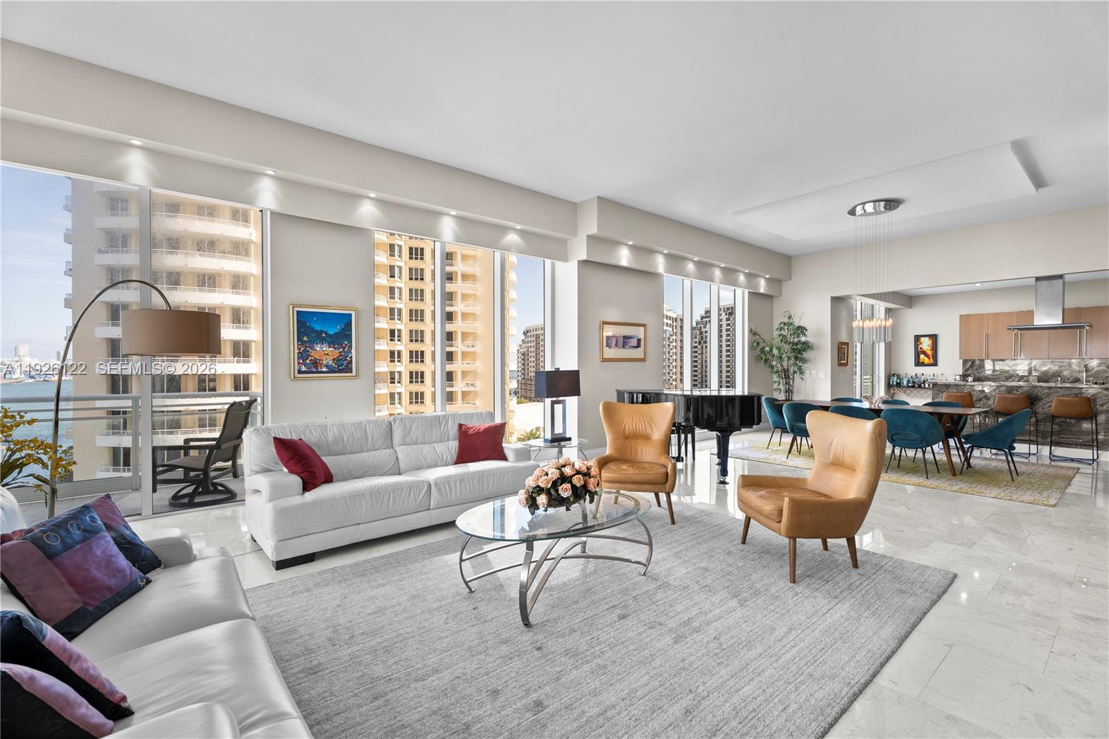 900 Brickell Key Boulevard, Unit 803 Miami, FL 33131 - Photo 7 of 38 a living room with furniture and a large window