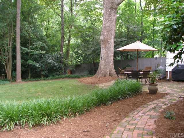 3203 Ruffin Street Raleigh, NC 27607 - Photo 7 of 8 I just can't say enough about this park-like backyard. You have two huge brick patios, a large grassy area and even space for a home garden! Back Yard