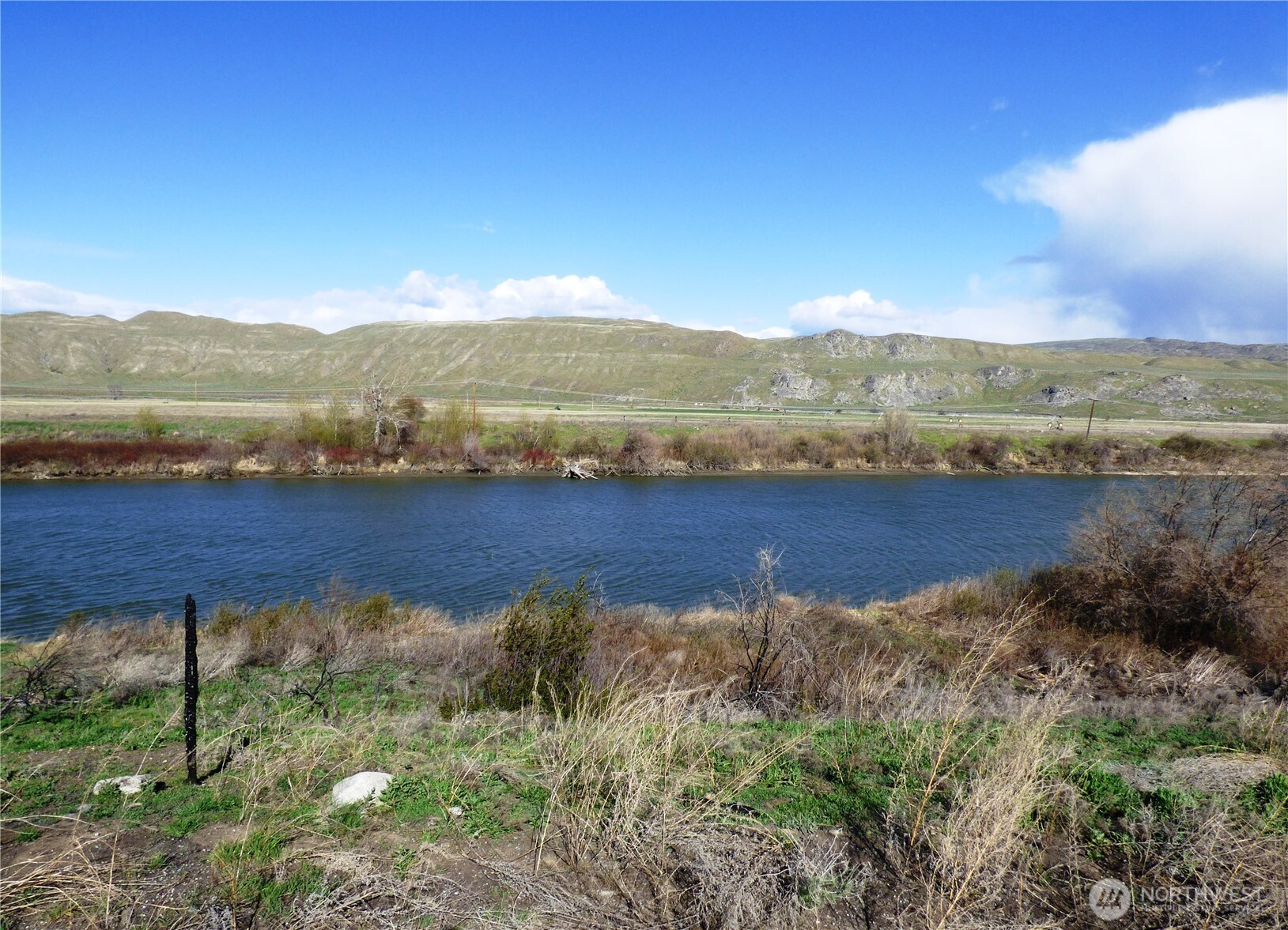 a view of a lake with mountains in the background