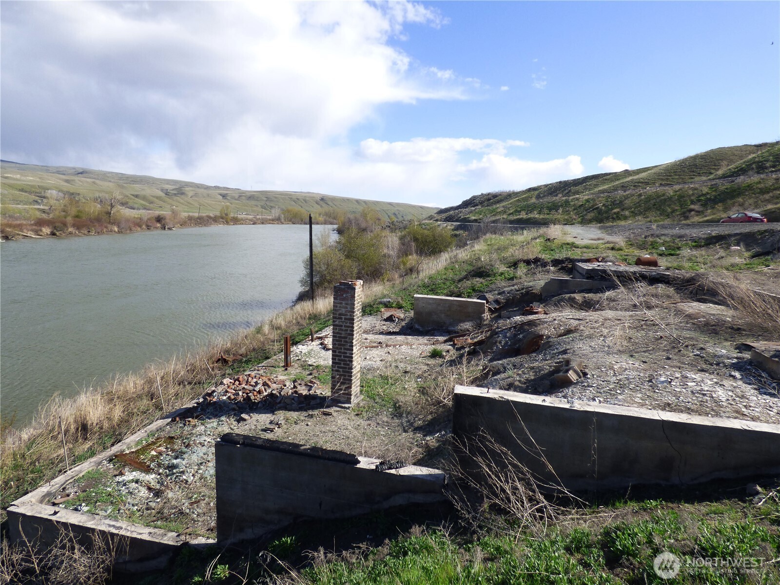 608 Monse River Road Brewster, WA 98812 - Photo 3 of 7 a view of a lake with a mountain in the background