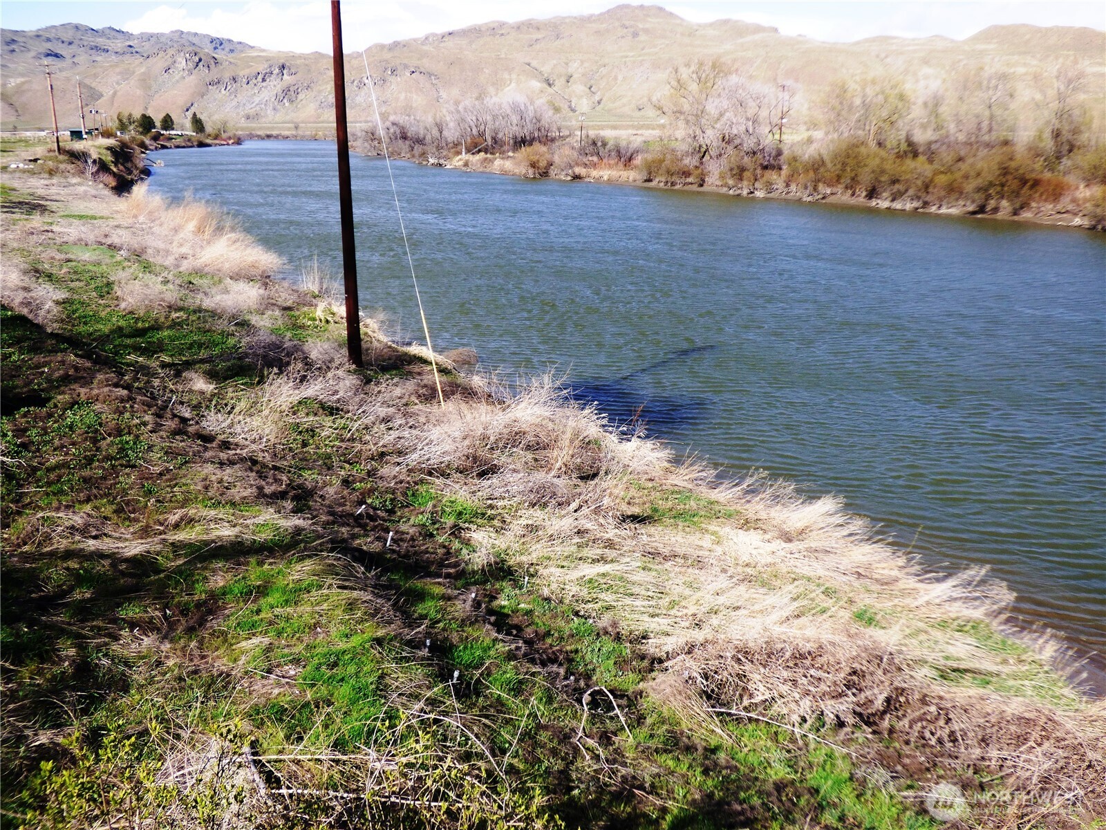 608 Monse River Road Brewster, WA 98812 - Photo 5 of 7 a view of a backyard of a house