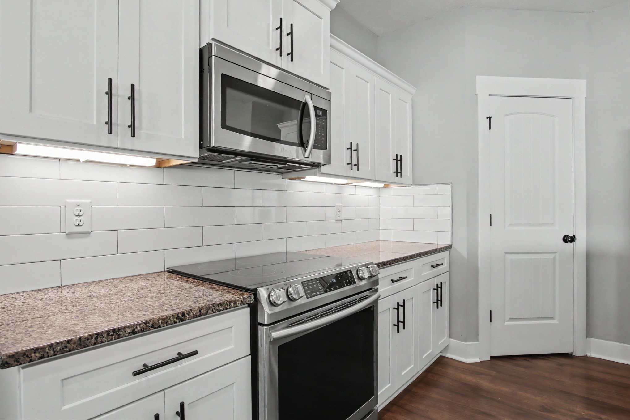 7208 Winding Way Pleasant View, TN 37146 - Photo 12 of 30 a kitchen with granite countertop a stove and a microwave
