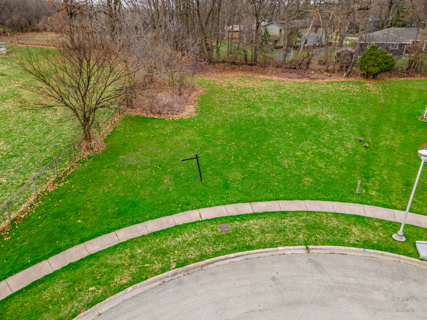 282 Amherst Meadow Bartlett, IL 60103 - Photo 5 of 6 a view of a garden with a bench