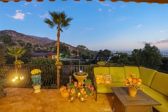 a kitchen with granite countertop stainless steel appliances a stove refrigerator and cabinets