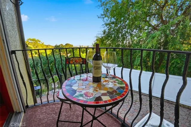 a kitchen with a sink wooden floor and a window