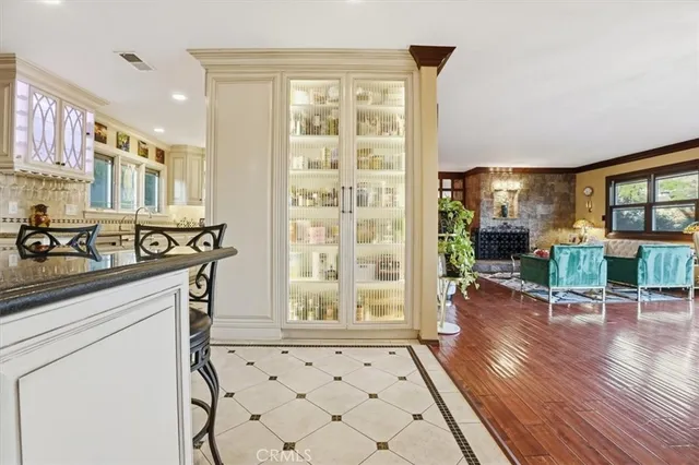 a bathroom with a glass door shower and a sink