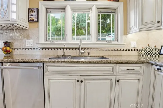 a spacious bathroom with a granite countertop sink a mirror and shower