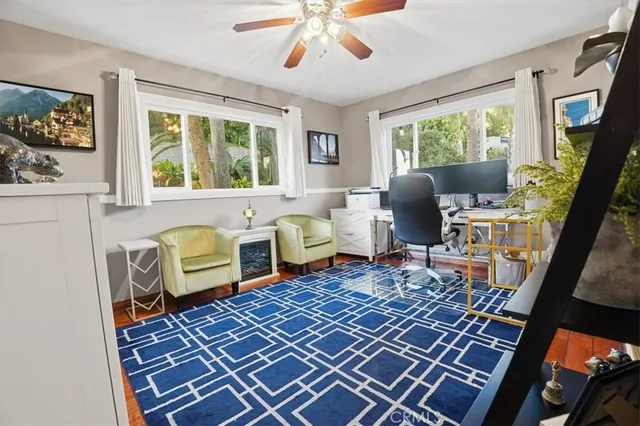 a room with pool table and windows