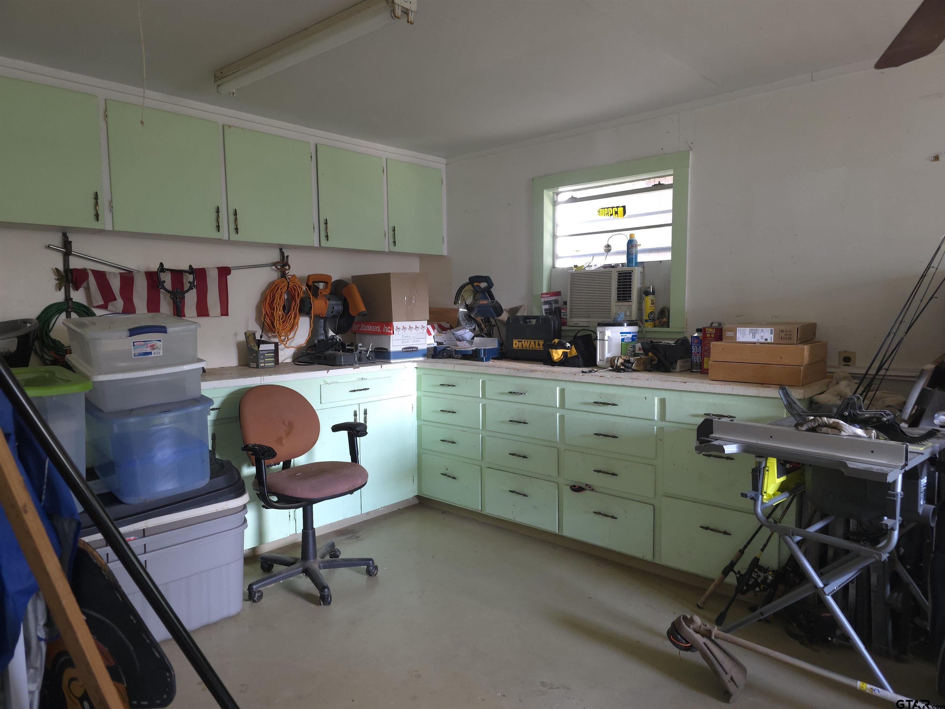 109 Randal Lane Pittsburg, TX 75686 - Photo 11 of 22 a view of a workspace with furniture and a window