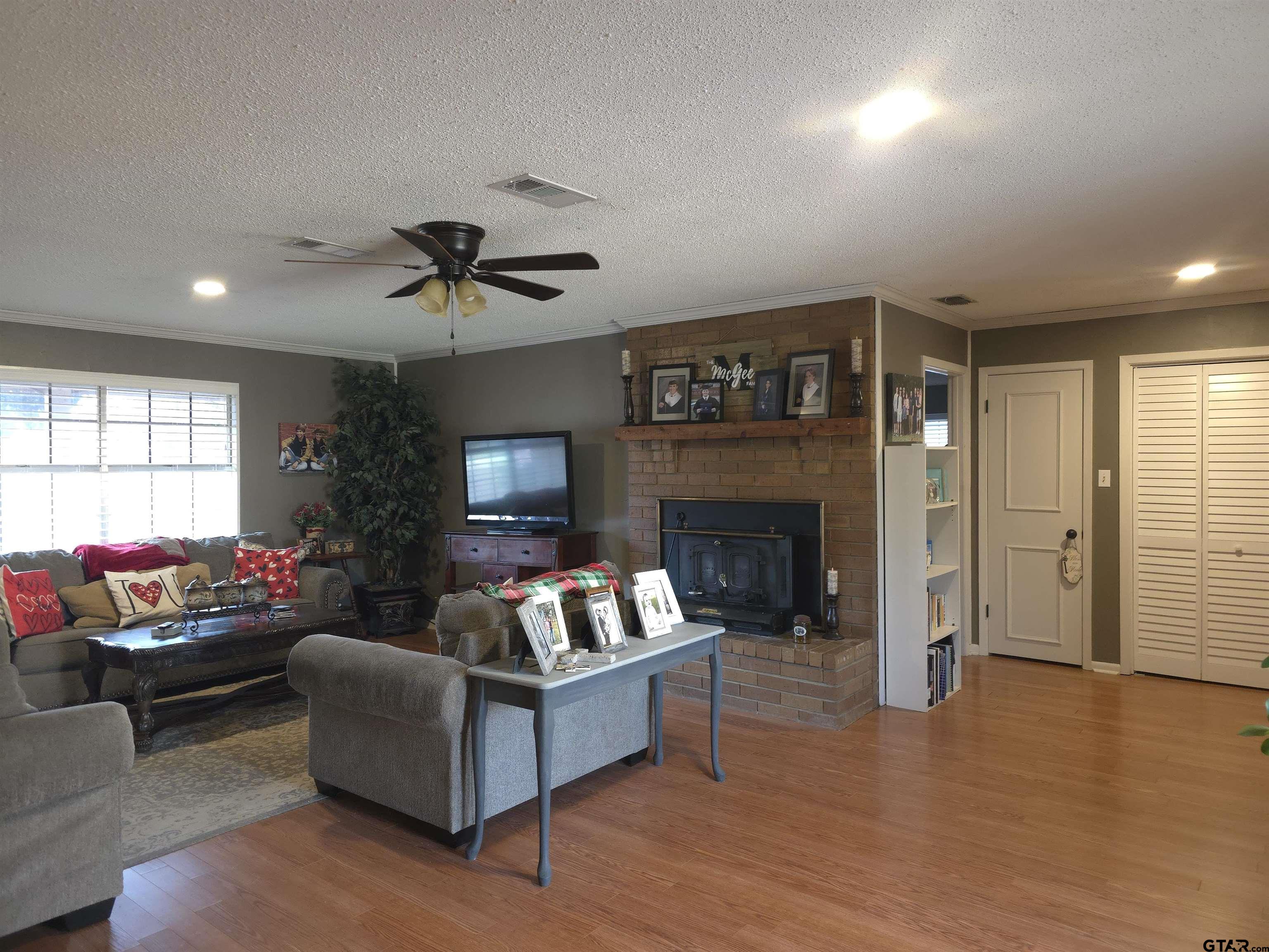 109 Randal Lane Pittsburg, TX 75686 - Photo 2 of 22 a living room with furniture and a fireplace