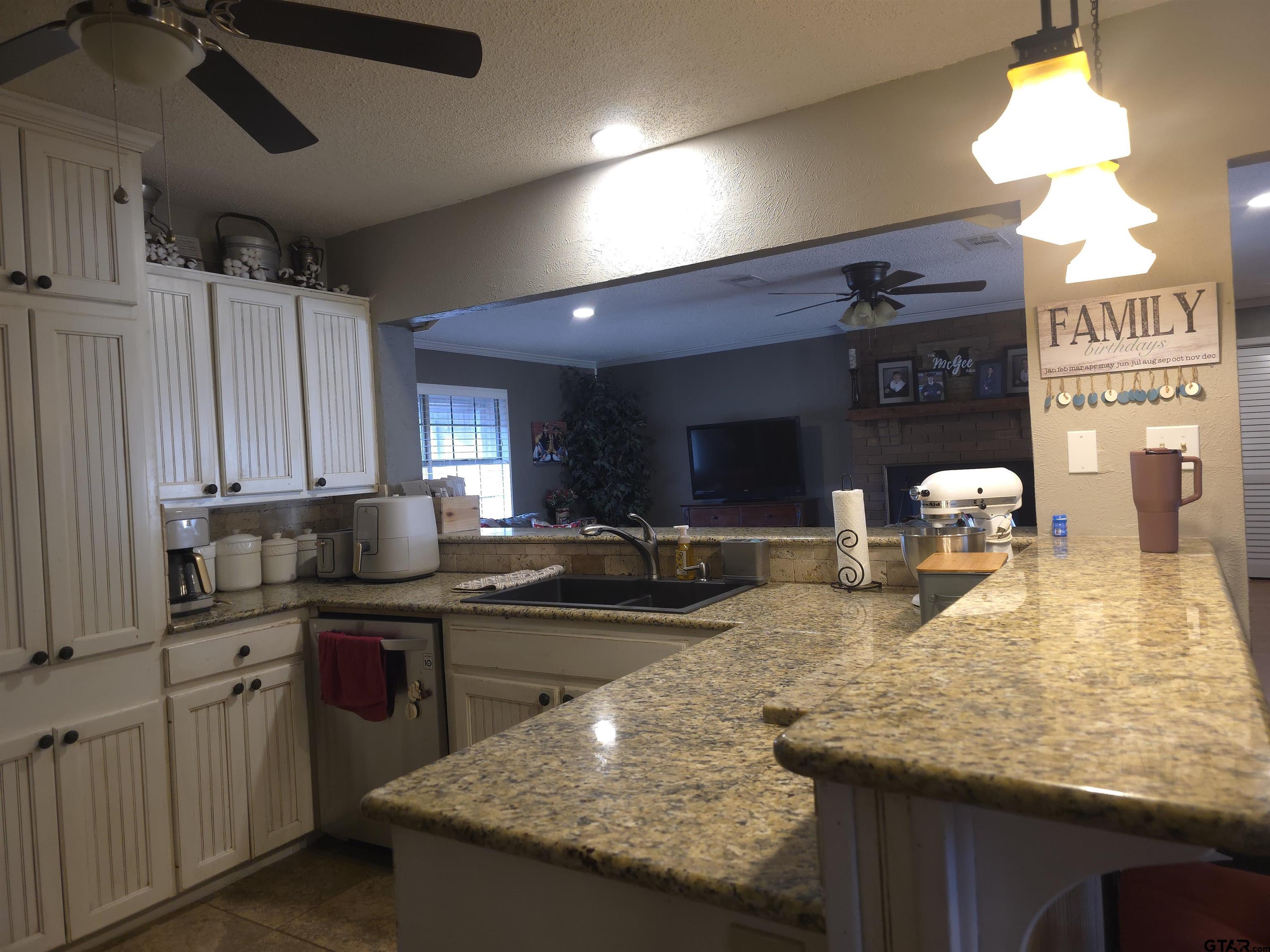 109 Randal Lane Pittsburg, TX 75686 - Photo 6 of 22 a kitchen with sink stove and cabinets