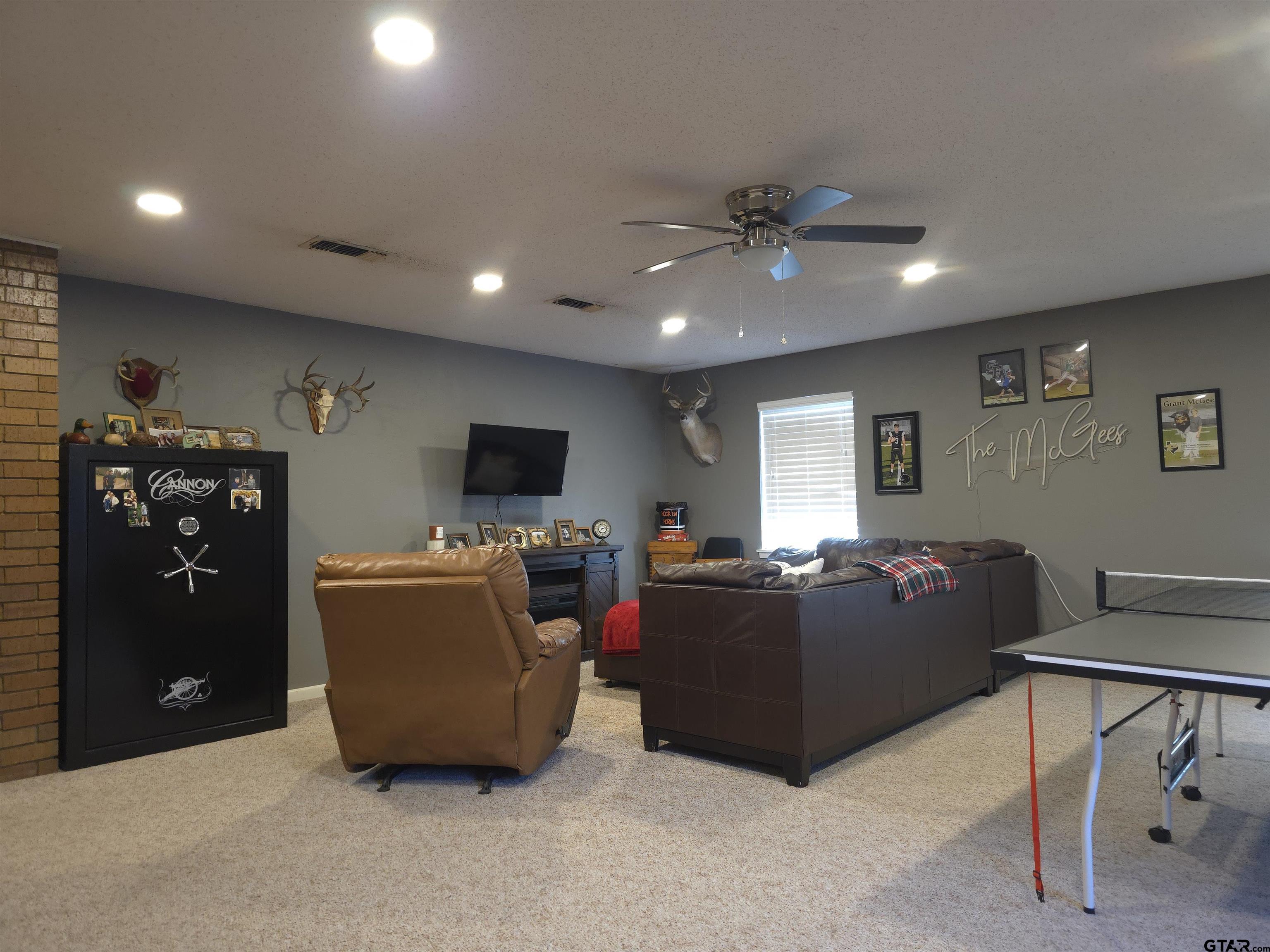 109 Randal Lane Pittsburg, TX 75686 - Photo 7 of 22 a living room with furniture and a flat screen tv