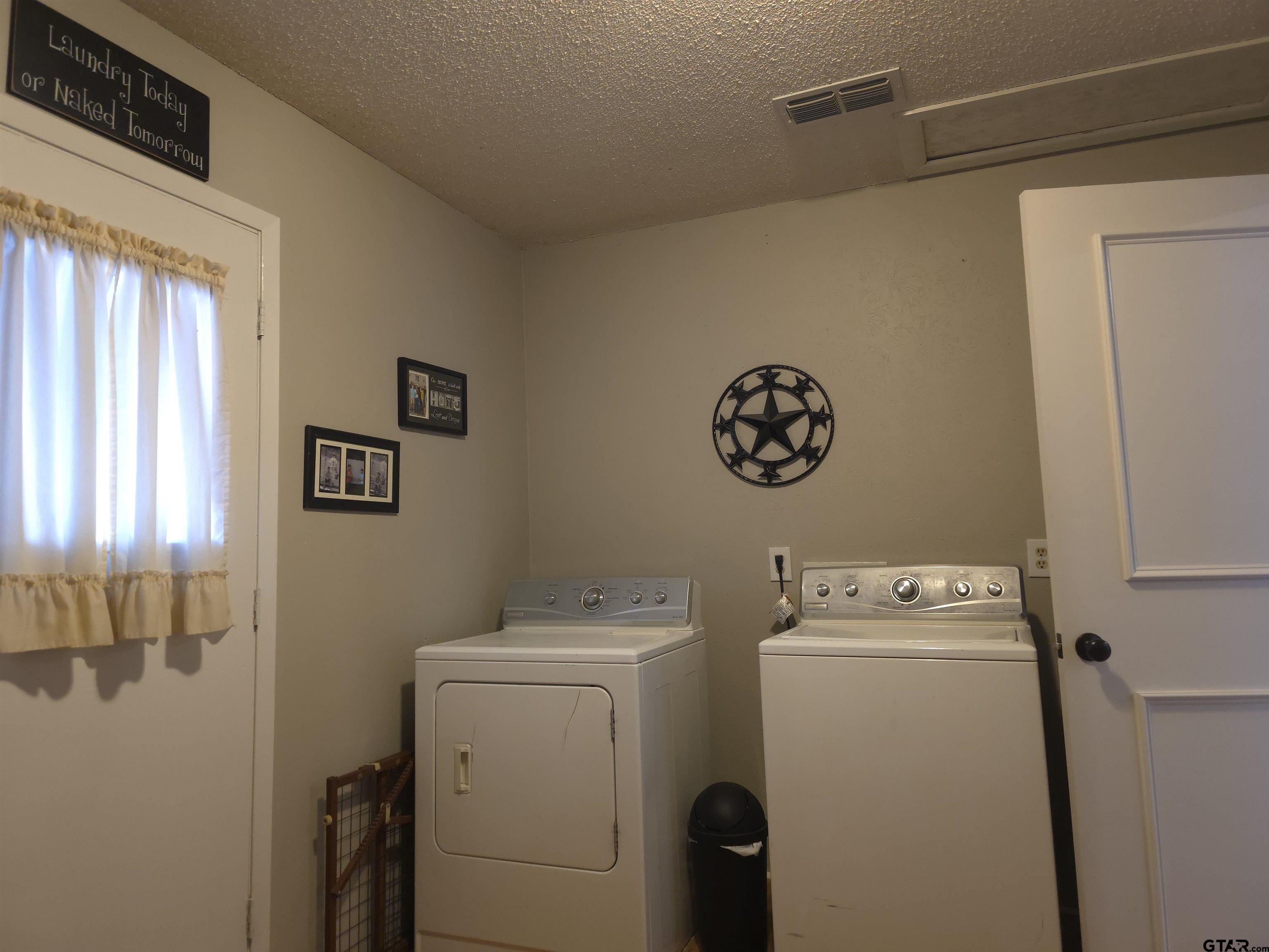 109 Randal Lane Pittsburg, TX 75686 - Photo 10 of 22 a utility room with dryer and washer