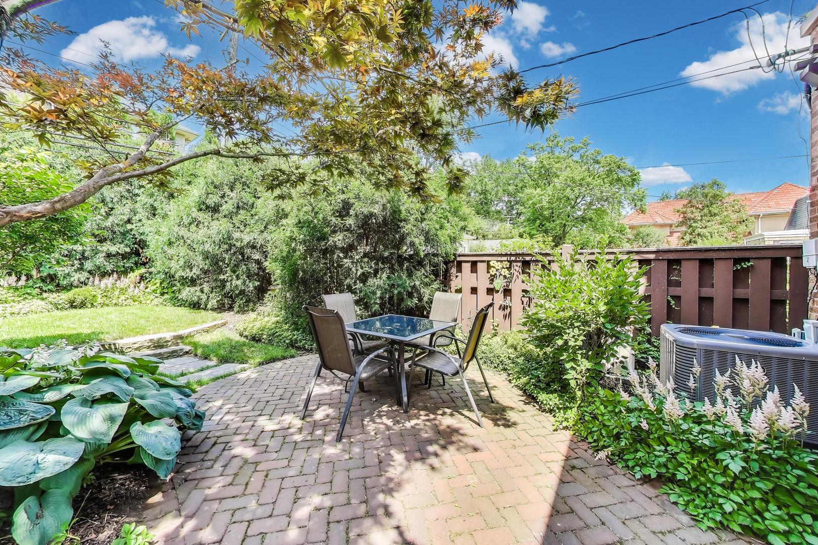 210 Berry Parkway Park Ridge, IL 60068 - Photo 26 of 30 a view of a patio with table and chairs and potted plants