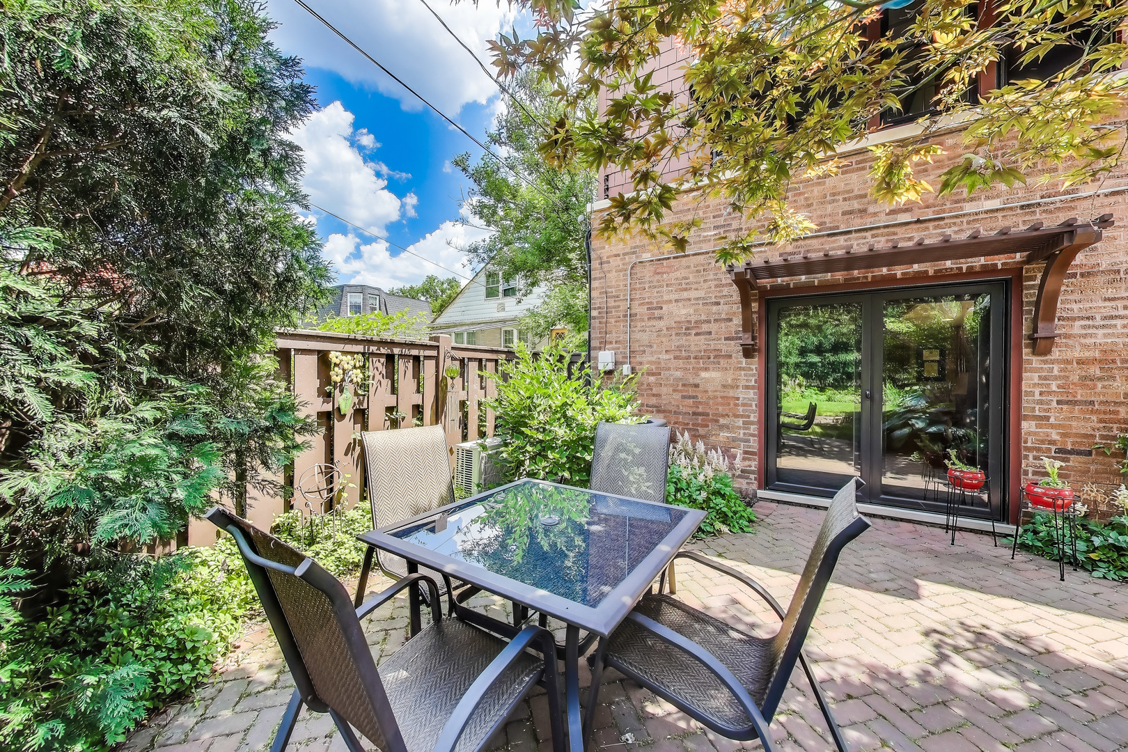 210 Berry Parkway Park Ridge, IL 60068 - Photo 27 of 30 a view of a patio with a table chairs and a potted plant