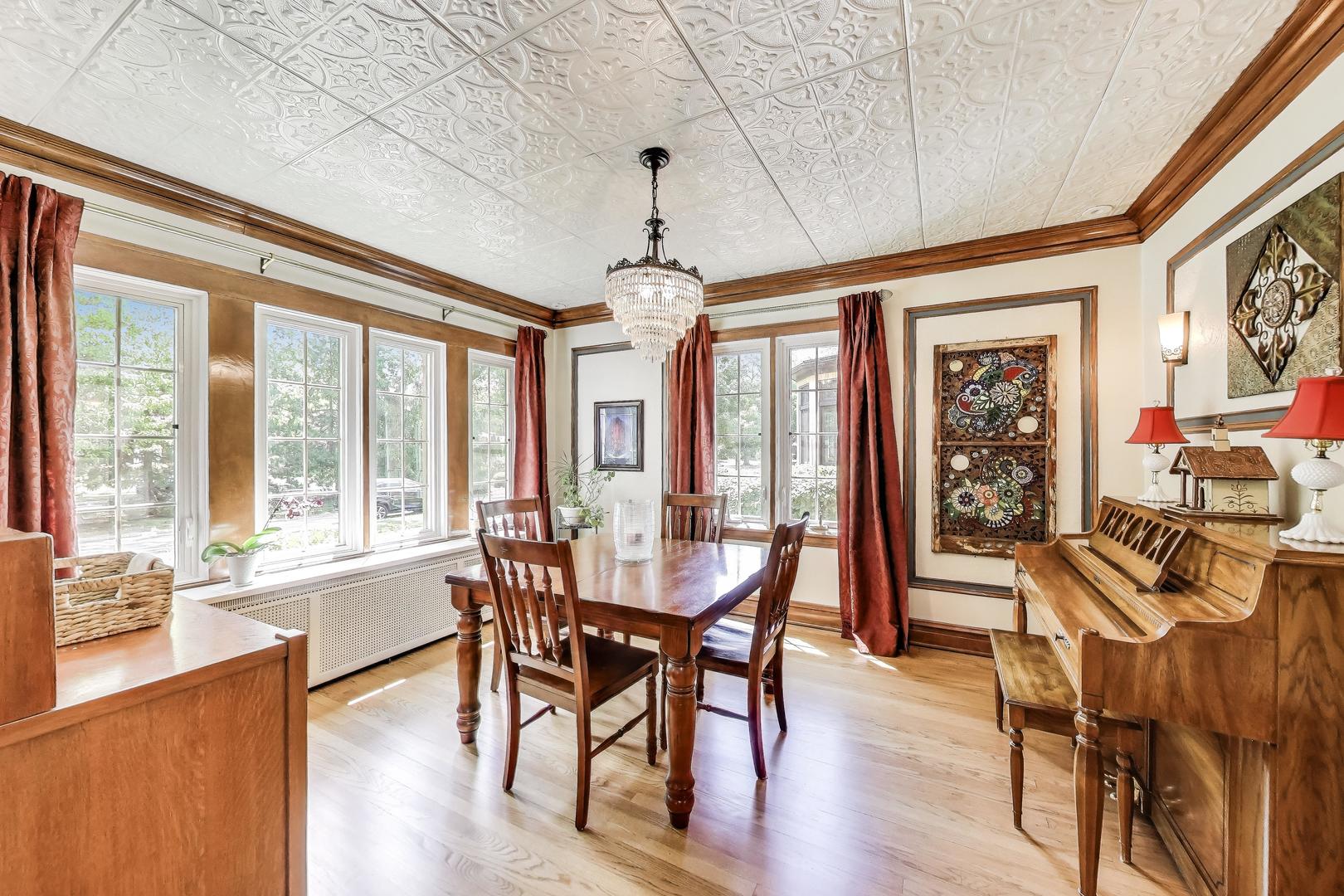 210 Berry Parkway Park Ridge, IL 60068 - Photo 5 of 30 a view of a dining room with furniture large windows and wooden floor