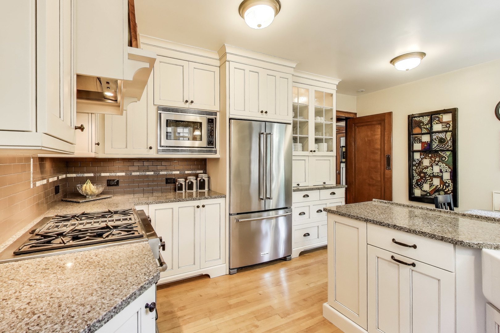 210 Berry Parkway Park Ridge, IL 60068 - Photo 8 of 30 a kitchen with stainless steel appliances granite countertop a refrigerator stove and sink