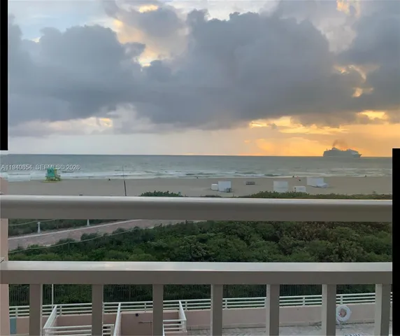 a view of a balcony with an outdoor space